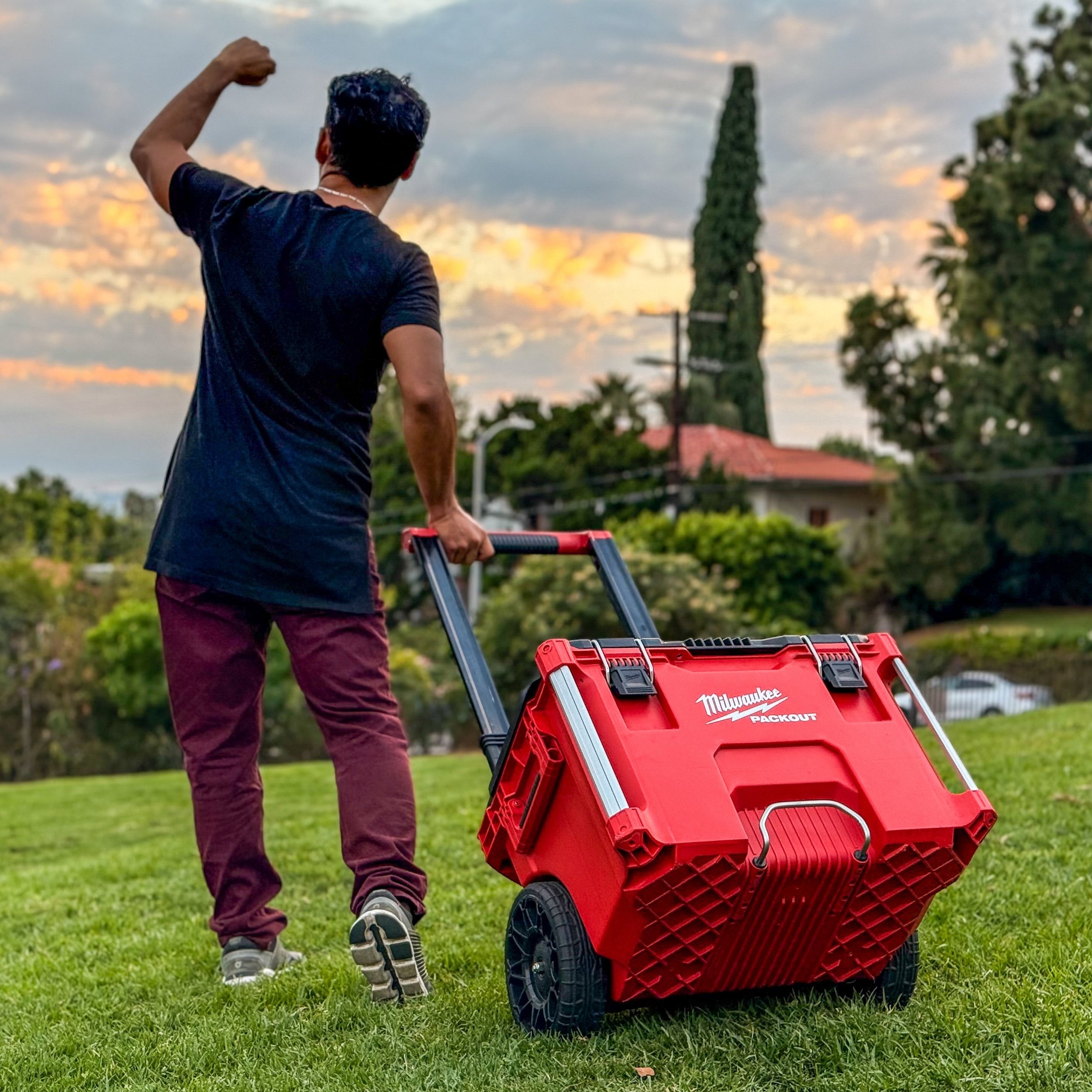 Tradesperson with a rolling tool case