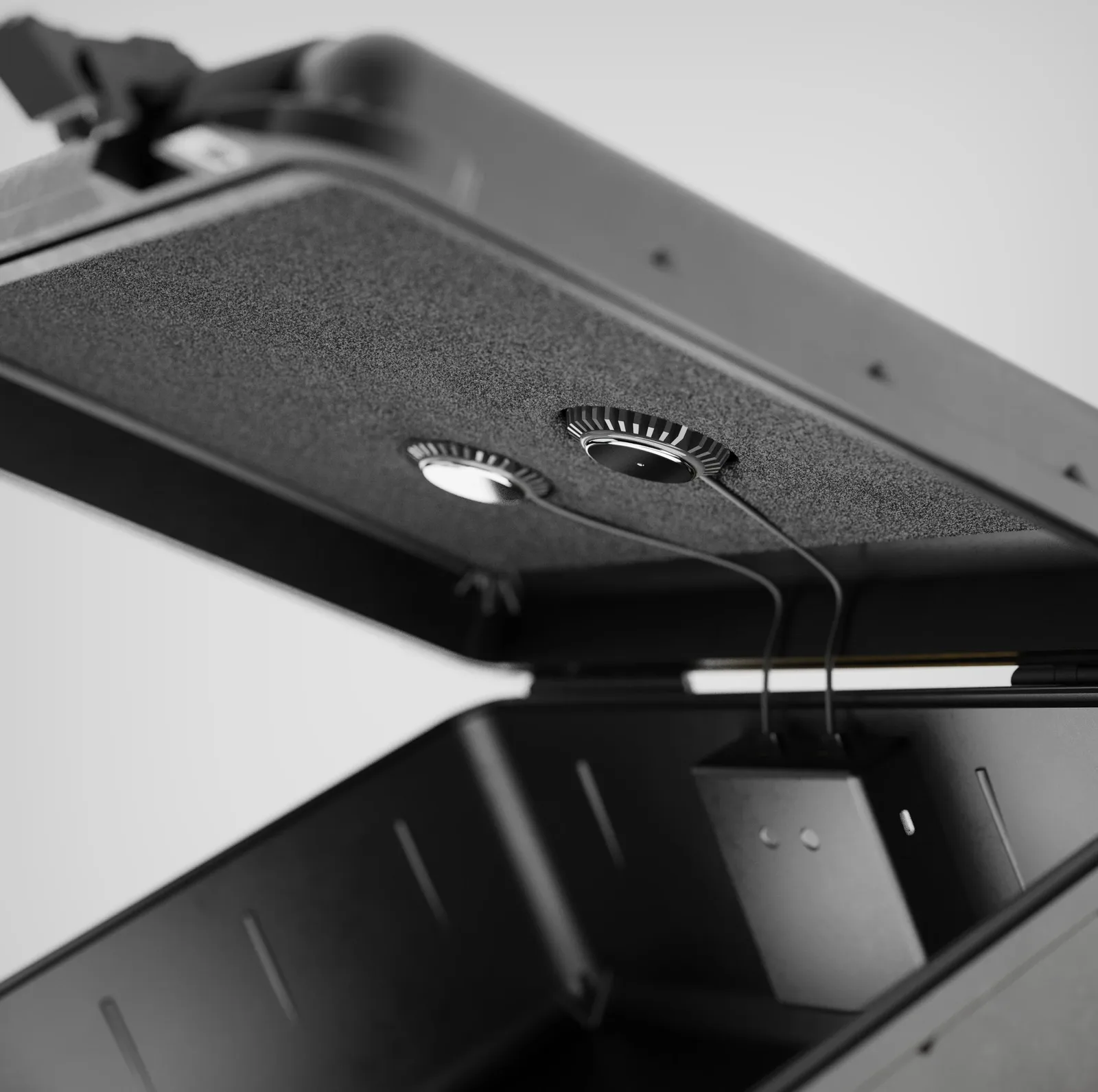 Close-up of Reso 2 sound pucks mounted inside a Pelican case lid